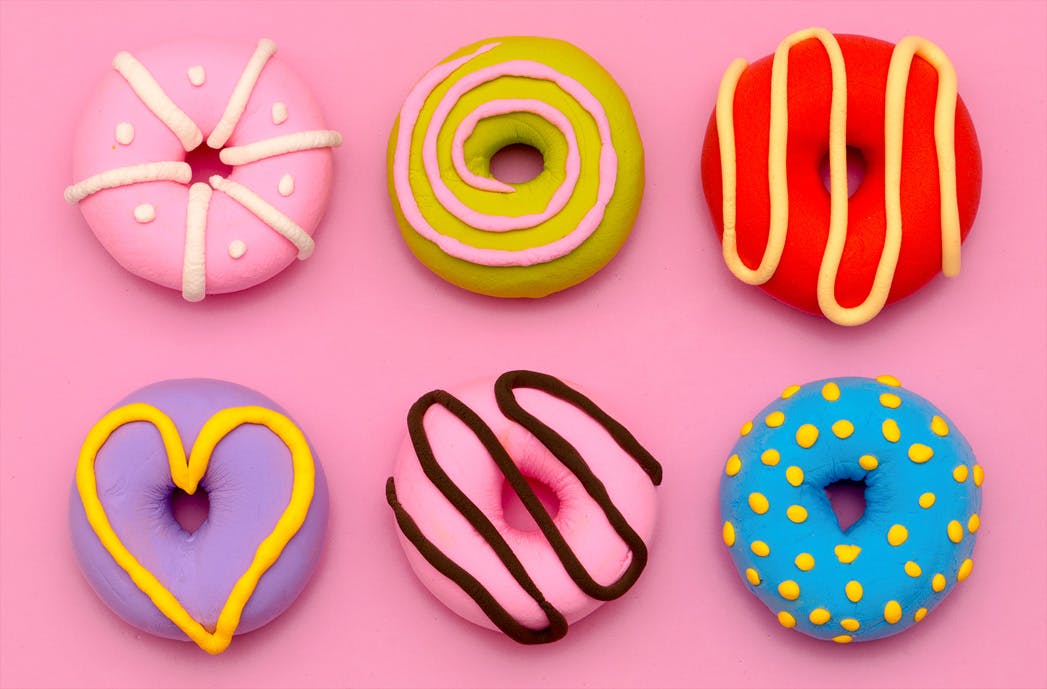 six multicoloured doughnuts