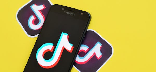 TikTok logo on smartphone. Editorial credit: Mehaniq / Shutterstock.com